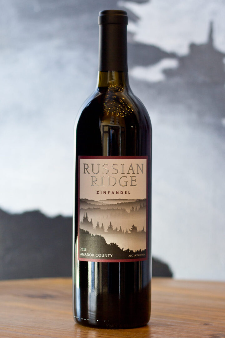 A bottle of russian ridge wine on top of a table.